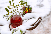 Red Christmas Glass Ball On Snow