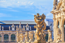 Cityscape - View Of A Sculptures On The Balustrade Against The Backdrop Of The Architecture Zwinger Palace Complex In Dresden, Germany