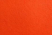 Orange Texture Velour Or Suede Cloth Close-up. Natural Or Artificial Sewing Material. Fabric As Background For Design.