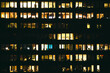© Alejandro Moreno de Carlos/Stocksy - Shiny windows of office building at night