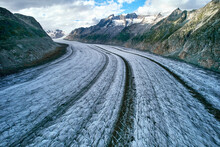 Aerial View Over Ice Of Aletsch Glacier, Most Grand In European Alps