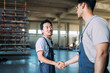 © Studio Firma/Stocksy - Two Factory Workers