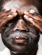 © ohlamour studio/Stocksy - Close up of man applying beauty product