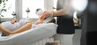 © PoppyPix - Beauty salon advertisement. Unrecognizable caucasian aesthetician in black uniform massaging the face of caucasian pregnant woman lying on her back. Blurred background. High quality photo