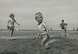 © Rene de Haan/Stocksy - boy playing at beach
