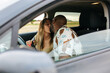 © Marco Govel/Stocksy - Couple kissing in car