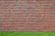 © Koen Van Damme/Stocksy - brick wall and lawn
