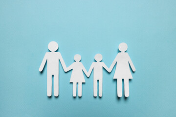 Wall Mural - Paper family figures on light blue background, top view. Insurance concept