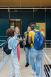 © VICTOR TORRES/Stocksy - Group of diverse friends with backpacks at university