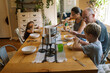 © Serena Burroughs/Stocksy - grandparents having dinner with their grandchildren