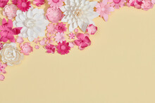 Top View Of Colorful Paper Cut Flowers On Beige Background