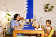© ByLorena/Stocksy - Children's coordinator with small child in office
