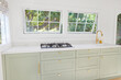 © Trinette Reed/Stocksy - Modern kitchen in small cottage home