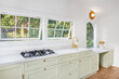 © Trinette Reed/Stocksy - Modern cute kitchen in small cottage home
