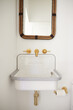 © Trinette Reed/Stocksy - Farmhouse sink in bathroom