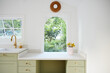 © Trinette Reed/Stocksy - Desk in modern cute kitchen