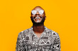 © VICTOR TORRES/Stocksy - Cheerful black man in trendy outfit
