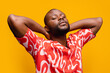 © VICTOR TORRES/Stocksy - Confident black man with raised arms in studio