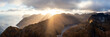 © Jason Denning/Stocksy - Moskenesoya mountains sun beam aerial Lofoten Islands