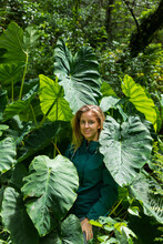 Portrait Of A Blonde Woman Among Giant Plants 
