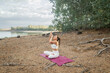 © Lupe Rodríguez/Stocksy - woman practicing yoga in nature
