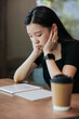 © Heng Yu/Stocksy - Young woman in a cafe reading an ebook