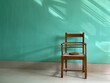 © Dream Lover/Stocksy - A wooden chair in front of a sun lit background