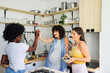 © Studio Firma/Stocksy - Three Women Having Fun in Kitchen