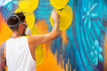 Graffiti Artist Painting Large Floral Mural