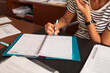 © Lightsy/Stocksy - Businesswoman taking notes