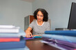 © Lightsy/Stocksy - Woman working with files in an office