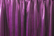 © Jelena Sijak/Stocksy - Shiny purple curtain with copy space.