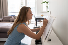 Woman Composing Music Piece