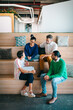 © Atolas/Stocksy - Group of colleagues having a meetup in creative co-working space