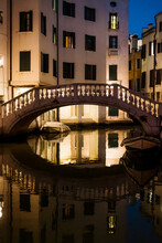 Bridge Over A Canal In Venice At Night