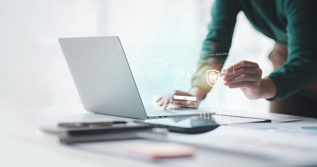Businessman typing on keyboard laptop computer to input username and password for or technology security system and prevent hacker increases the security of your account concept.	