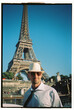 © Tessy Morelli/Stocksy - Man portrait in Paris wearing smart outfit with tie and sunglasses