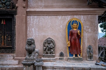 Wall Mural - Buddha statue with lions in temple of Kathmandu