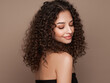 © Oleg Gekman - Fashion studio portrait of beautiful smiling woman with afro curly hairstyle. Fashion and beauty