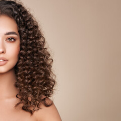 Wall Mural - fashion studio portrait of beautiful woman with afro curls hairstyle. facial treatment. cosmetology,