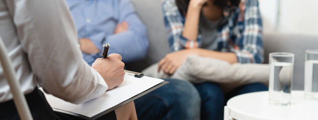 Wall Mural - psychologist talking with married couple about depression of husband.