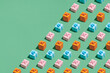 © Marc Tran/Stocksy - Pattern made from present gift boxes on green background