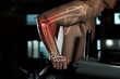 © New Africa - Digital composite of highlighted bones and strong man working out on parallel bars in gym, closeup