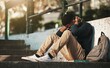 © Allistair F/peopleimages.com - Student, mental health and depression with anxiety, burnout and sad for exam results, fail or mistake while sitting outdoor. Young man, stress and tired and depressed on university or college campus