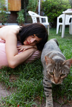 Girl Sitting In A Summer Day With Cute Cat