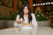 © ByLorena/Stocksy - Woman eating pasta without excitement