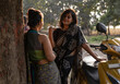 © Dream Lover/Stocksy - Indian woman wearing traditional  sari dress interacting at outdoors