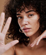 Hand, portrait and woman in studio for skincare, beauty and wellness, sexy and attitude. Face, skin and girl model showing stop hand sign, saying no to ageing and satisfied with natural product