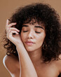 © J Maas/peopleimages.com - Beauty, skincare and wellness by woman in studio for relax, zen and glamour makeup, pamper and treatment with mockup. Black woman, hair care and wellness girl model calm and satisfied with cosmetics