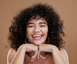 © Jade M/peopleimages.com - Beauty, skincare and black woman in studio with natural hair and happy about cosmetics, makeup and dermatology product on brown background. Happiness, dermatology and self love of an African model